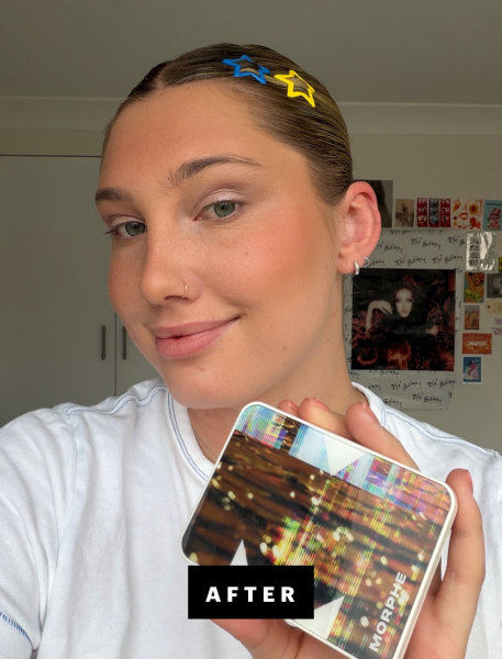 Katie Gunderman holding up a Morphe eyeshadow palette